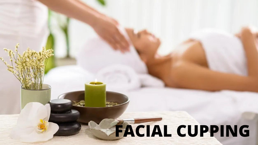 Woman laying down having a Facial with Facial Cupping